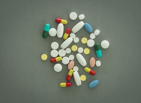 pills on gray background. view from above.