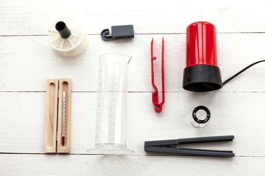 Elements related to developing photographic film in an old photo lab on white background view from above