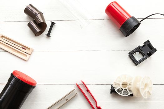 Elements related to developing photographic film in an old photo lab on white background view from above