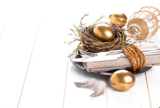 table decoration on white wooden background with Chicken golden egg