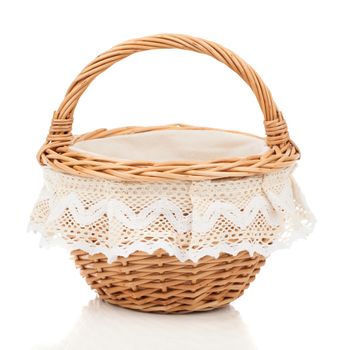 Brown small wicker basket isolated over the white background