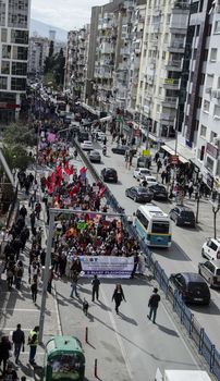 TURKEY, Izmir: Protesters march behind a banner during a demonstration held in Izmir, Turkey on March 6, 2016 prior to International Women's Day (March 8).
