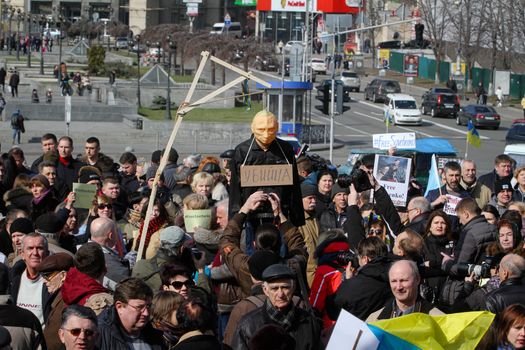 UKRAINE, Kiev: A man holds scaffold with a mannequin of Russian President Vladimir Putin hanging on during a rally to claim Nadiya Savchenko's release in Kiev on March 6, 2016. About thousand people gather in the Independence square downtown Kiev to voice the support for Nadiya Savchenko - “Aydar” Ukrainian volunteer battalion soldier, who is illegally held in Russian captivity after being kidnapped. Savchenko went on a dry hunger strike on March 4, 2016, after being over 75 days of hunger strike.