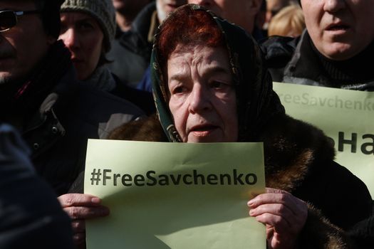 UKRAINE, Kiev: A woman holds placard which says #FreeSavchenko during a rally to claim Nadiya Savchenko's release in Kiev on March 6, 2016. About thousand people gather in the Independence square downtown Kiev to voice the support for Nadiya Savchenko - “Aydar” Ukrainian volunteer battalion soldier, who is illegally held in Russian captivity after being kidnapped. Savchenko went on a dry hunger strike on March 4, 2016, after being over 75 days of hunger strike.