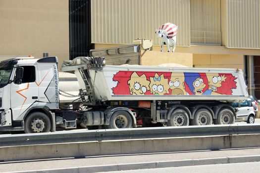 Fontvieille, Monaco - September 18, 2015: Dump Truck Trailer with characters from the Cartoon The Simpsons. South of France