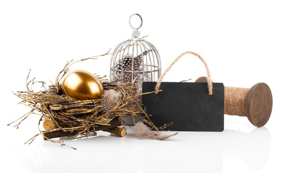 golden egg in nest with blackboard with space for text, on white background