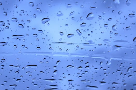 Drops of rain on glass