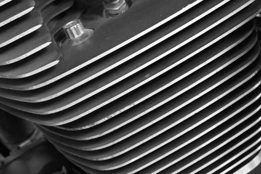 close up cylinder fins of motorcycle black and white style