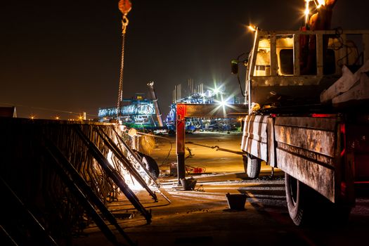 Express way construction site while worker working at night in Bangkok, Thailand