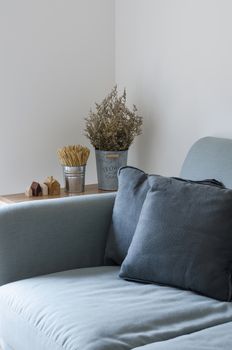 Modern sofa with dry plant decorated on side table