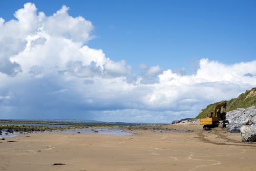 mechanical excavator working on coastal protection for the ballybunion golf course in ireland