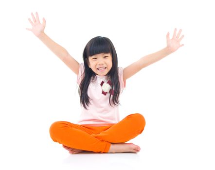 Beautiful child sitting on the floor and laugh