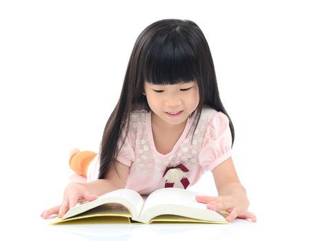 Asian girl reading on the floor