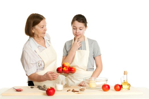 the grandmother and the granddaughter choose apples for pie