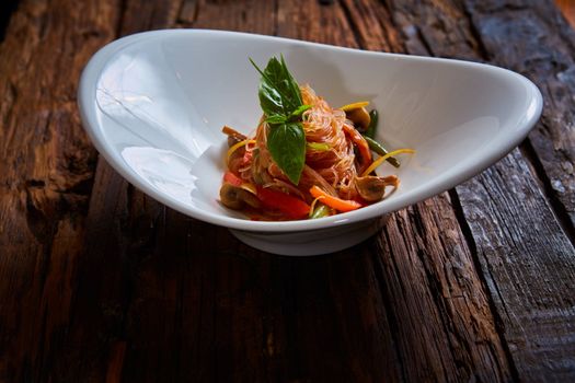 Glass noodles with mushrooms and vegetables. Dish of Korean cuisine