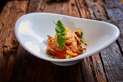 Glass noodles with mushrooms and vegetables. Dish of Korean cuisine