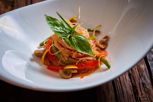 Glass noodles with mushrooms and vegetables. Dish of Korean cuisine
