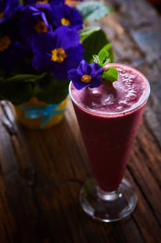 Delicious berry smoothie on table. The close-up