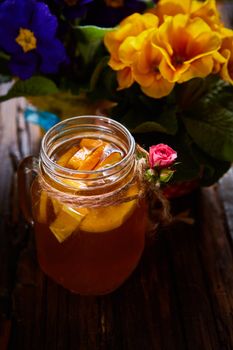 Ginger tea with orange, spices and honey. Shallow dof