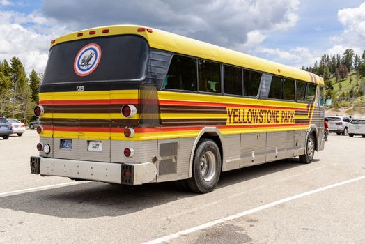 Yellowstone National Park, Wyoming, USA - May 31, 205: Tour of Yellowstone national park bus with side signs.Bus parked at the Mud Volcano Area on the Grand Loops Road in Yellowstone National Park in Wyoming.