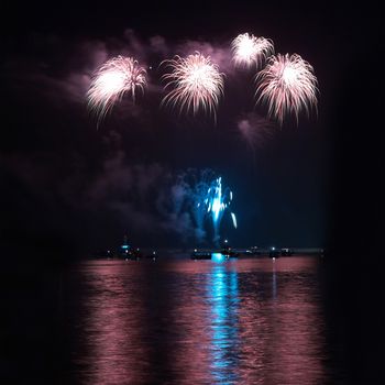 Colorful holiday fireworks on the black sky background.