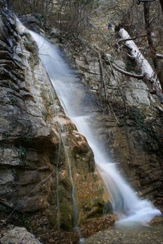 Beautiful waterfall in the forest. Water motion.