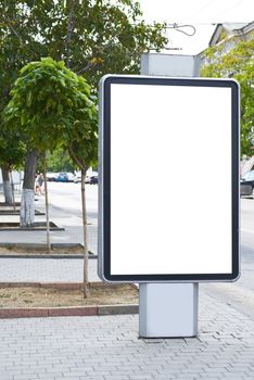 Vertical blank billboard on the city street