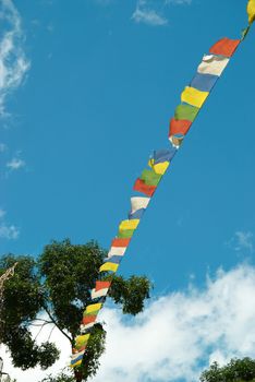 Tibetan prayer colorful flags with the blue sky