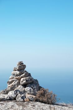 Stone tower - stack of zen stones on a blue sky background