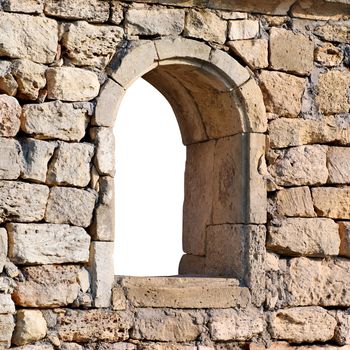 Window in the ancient stone wall white isolated