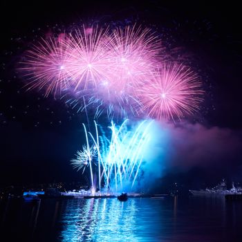 Blue colorful fireworks on the black sky background