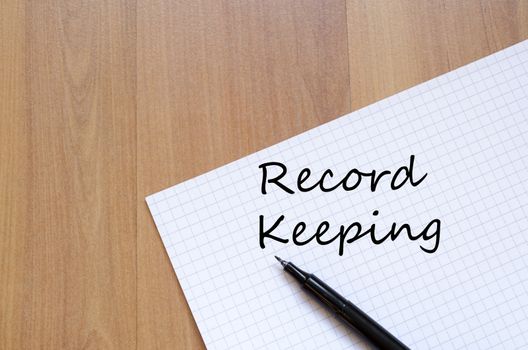 Record keeping text concept write on notebook with pen