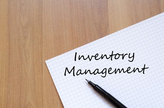Inventory management text concept write on notebook with pen