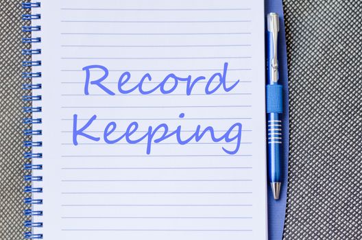 Record keeping text concept write on notebook with pen