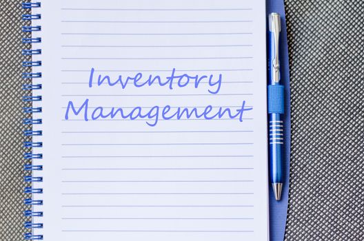 Inventory management text concept write on notebook with pen