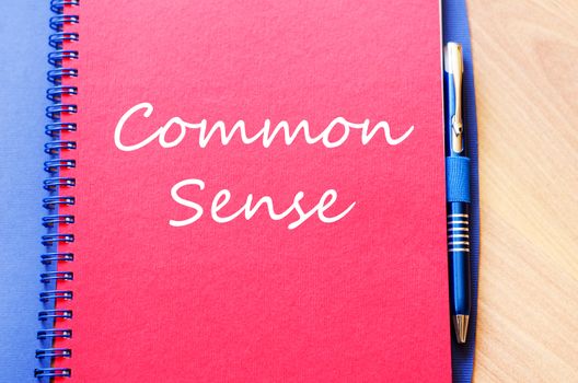 Common sense text concept write on notebook with pen