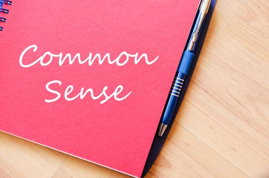 Common sense text concept write on notebook with pen