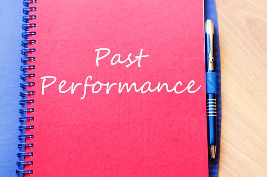 Past performance text concept write on notebook with pen