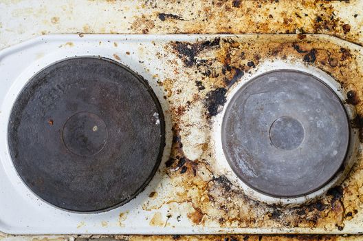 Very dirty hot plate in the kitchen
