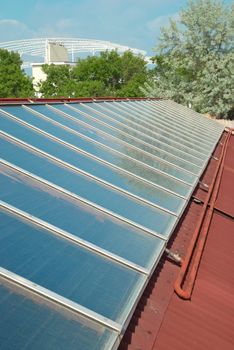 Solar water heating system on the red roof. Gelio panels.