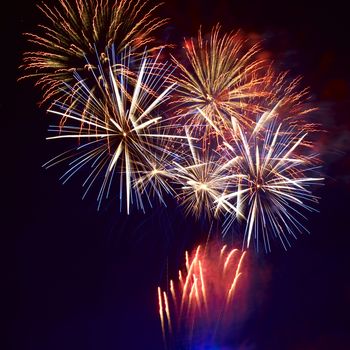 Red colorful fireworks on the black sky background