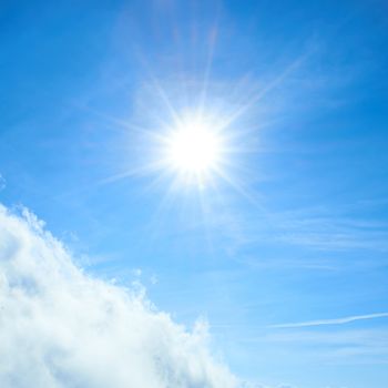 Beautiful blue sky with sun and clouds