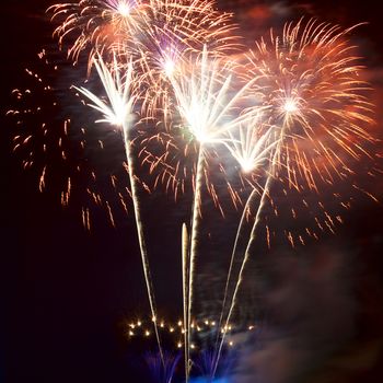 Red colorful fireworks on the black sky background