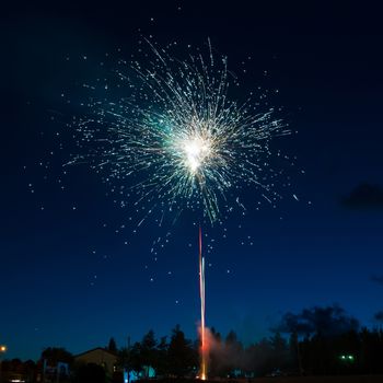 Blue colorful fireworks on night sky background