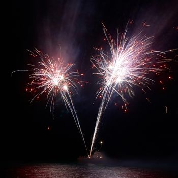 Colorful fireworks on the black sky background