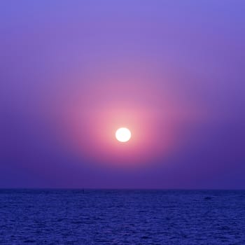 Beautiful colorful sunset on the sea with shining sun