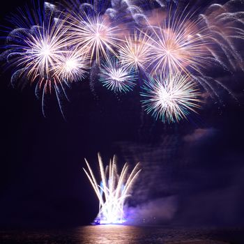 Blue colorful fireworks on the black sky background