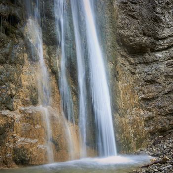 Beautiful waterfall in the forest. Water motion.