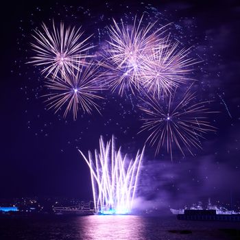 Blue colorful fireworks on the black sky background