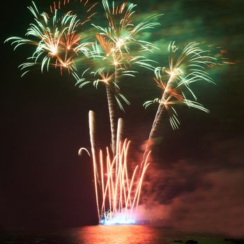 Red colorful fireworks on the black sky background